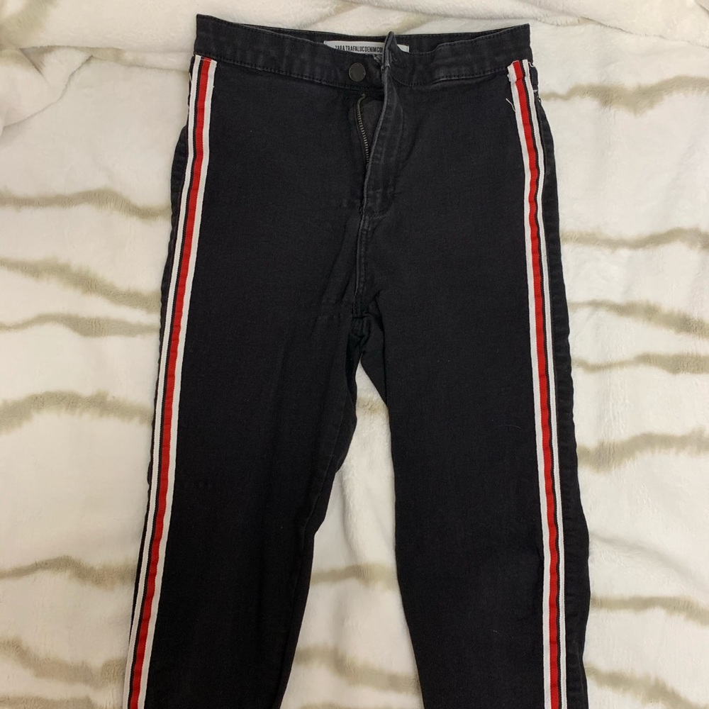 zara black jeans with red & white stripes on side